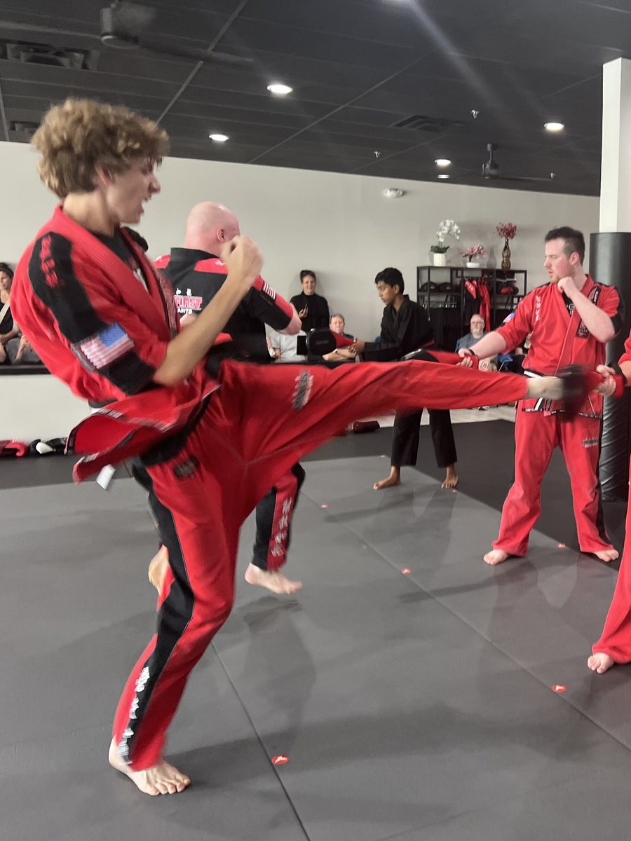 A teen Gladiators student throwing a kick at Family First Martial Arts Franklin