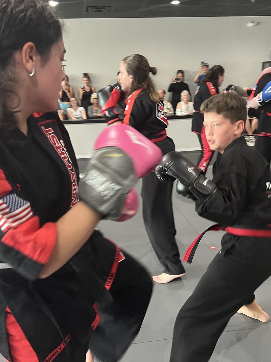 Guardian Kids students working a partner drill at Family First Franklin