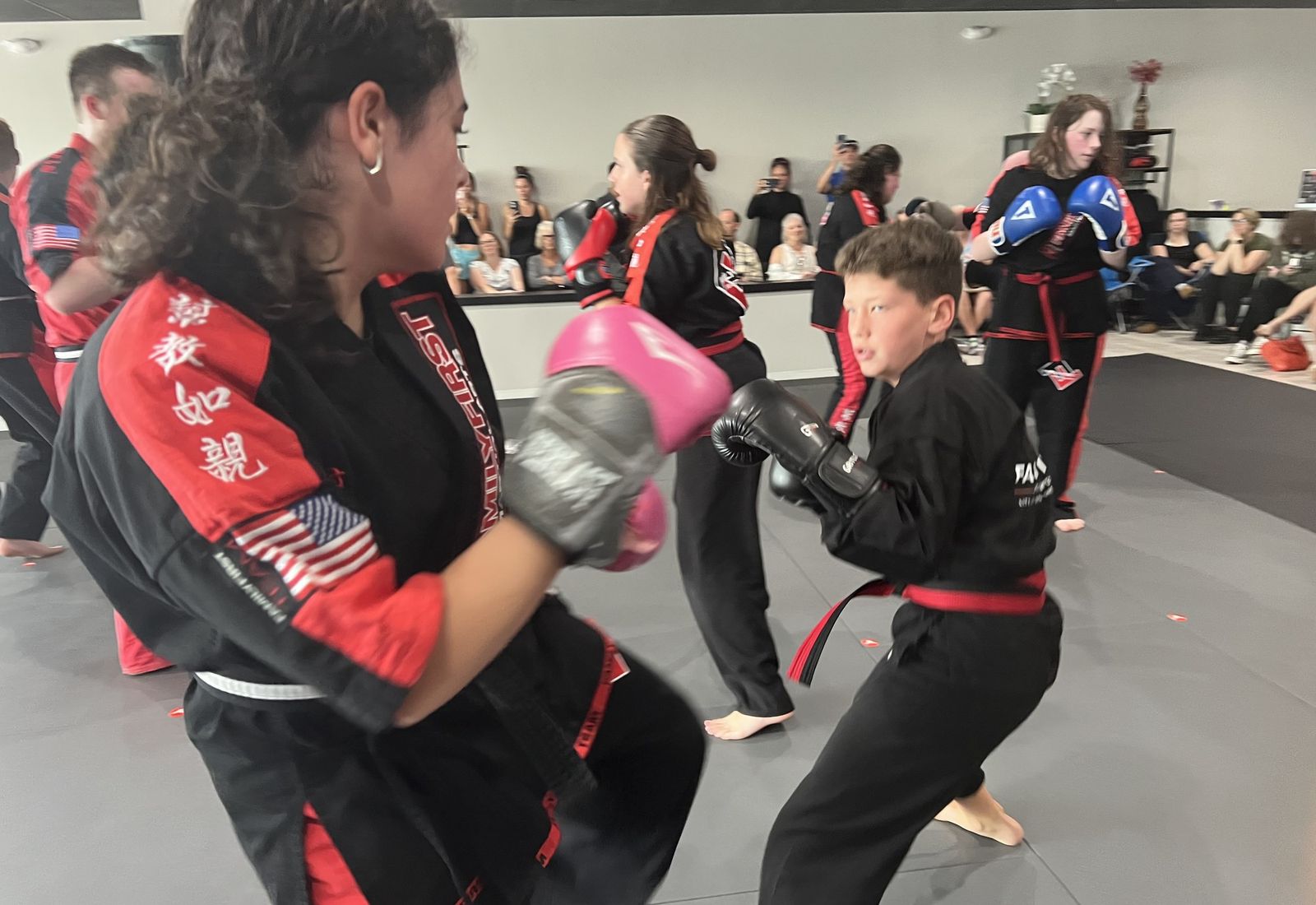 Guardian Kids students sparring with a coach at Family First Martial Arts Franklin
