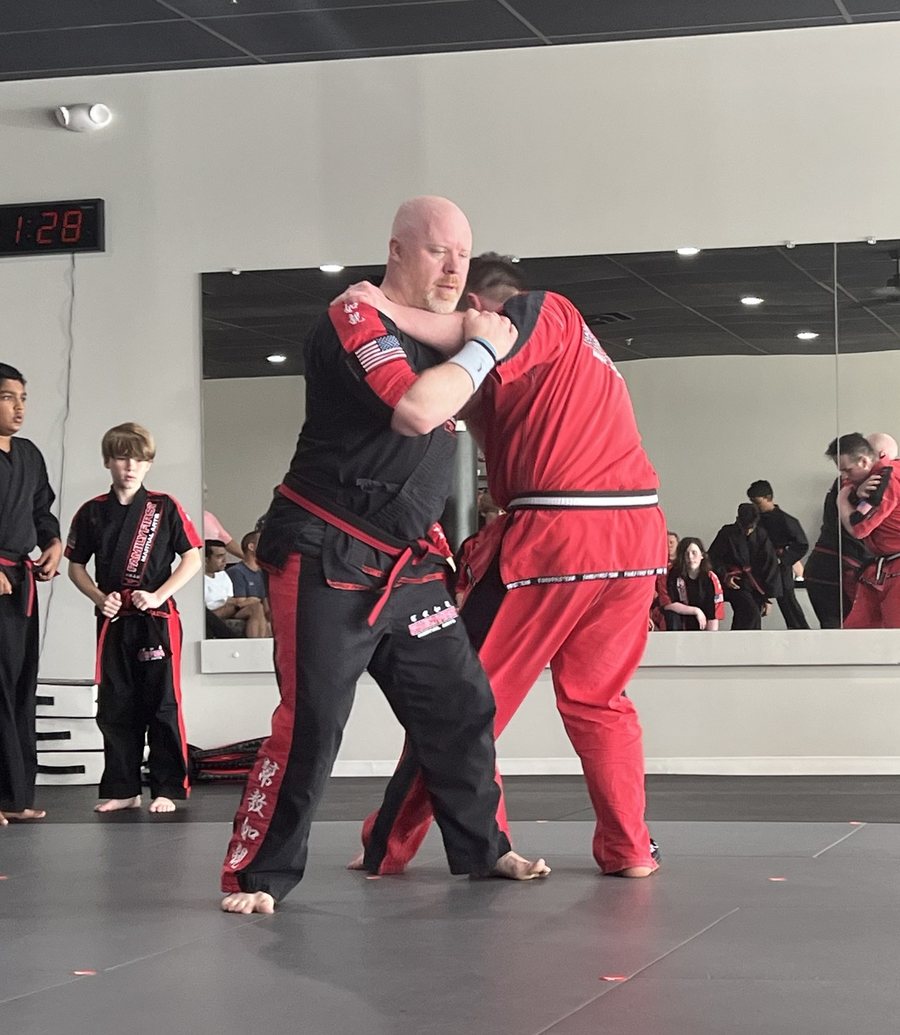 Adult Gladiators students drilling a clinch at Family First Martial Arts Franklin