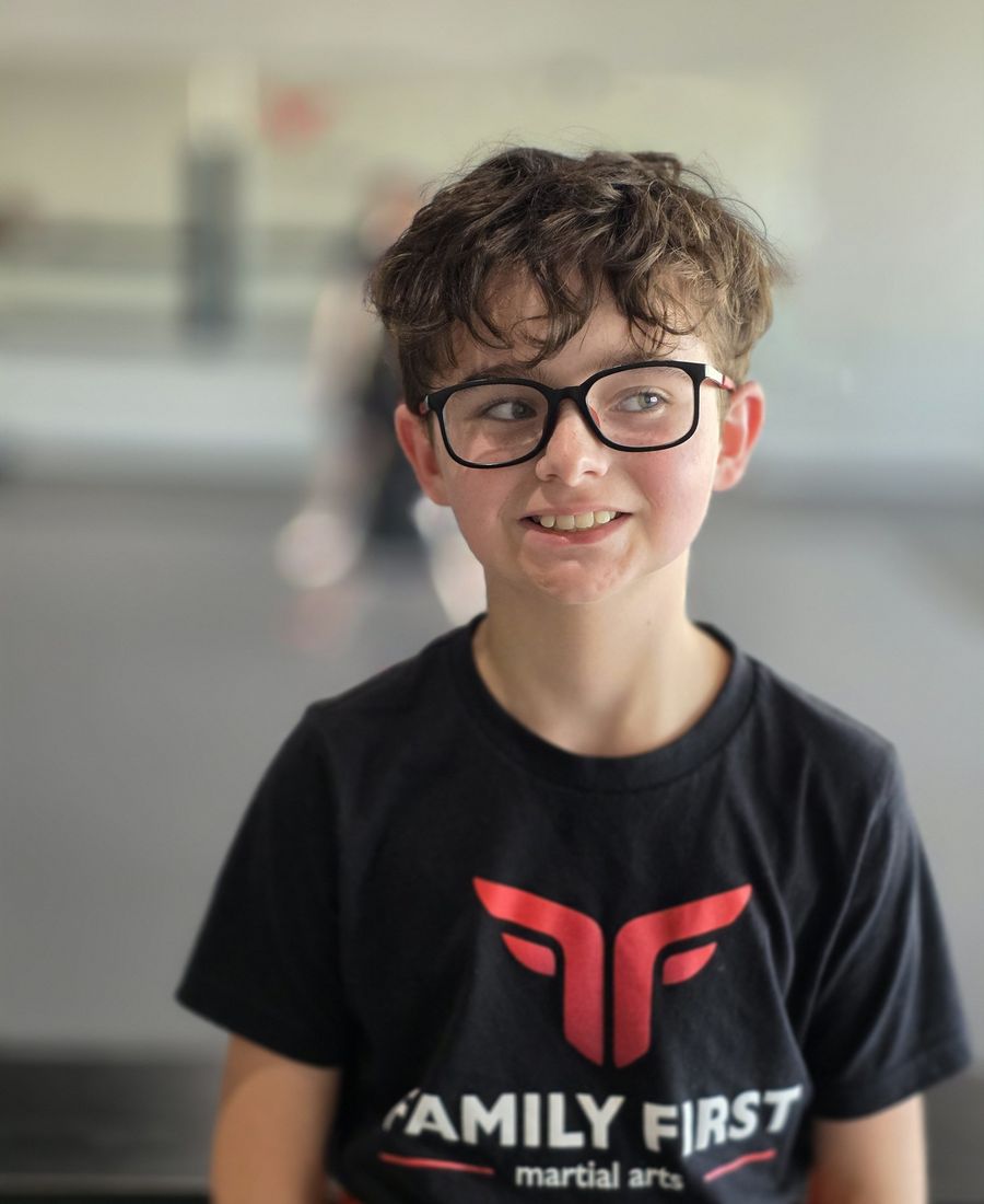 Smiling Tiny Titans student